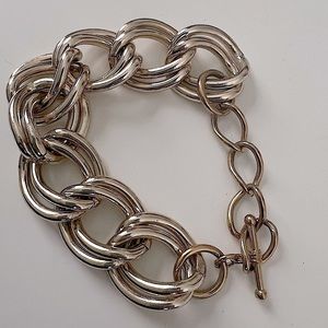 Honey hue 2 gold tone link bracelet.